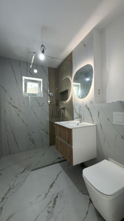 Apartament 3 camere, 2 bai, etaj 1 decomandat, 65 mp utili - Dambovita